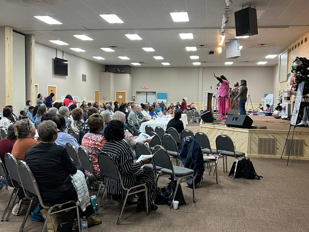 2025 Becoming Project event — audience in the main hall