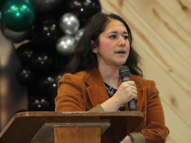 2025 Becoming Project — woman speaking at podium