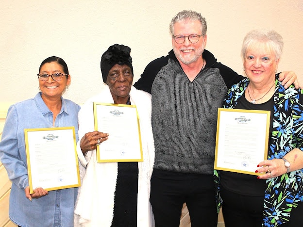 2025 Awards — community award recipients holding certificates