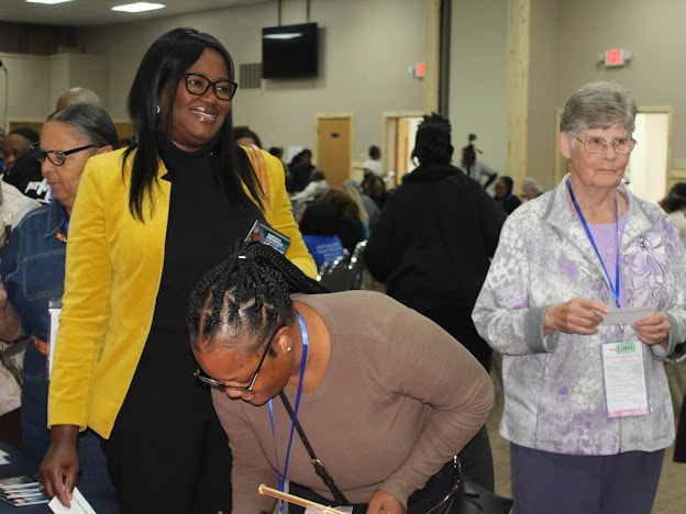 2025 Becoming Project — women at registration check-in table
