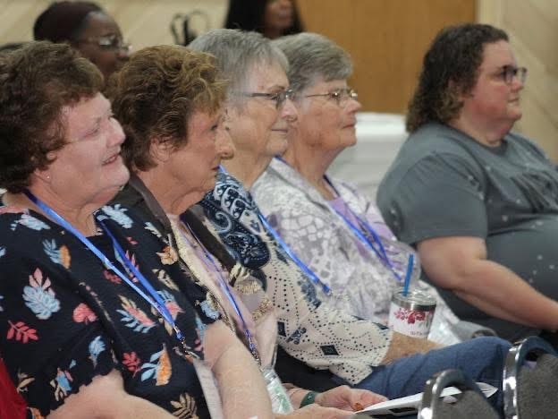 2025 Becoming Project — group seated at conference event